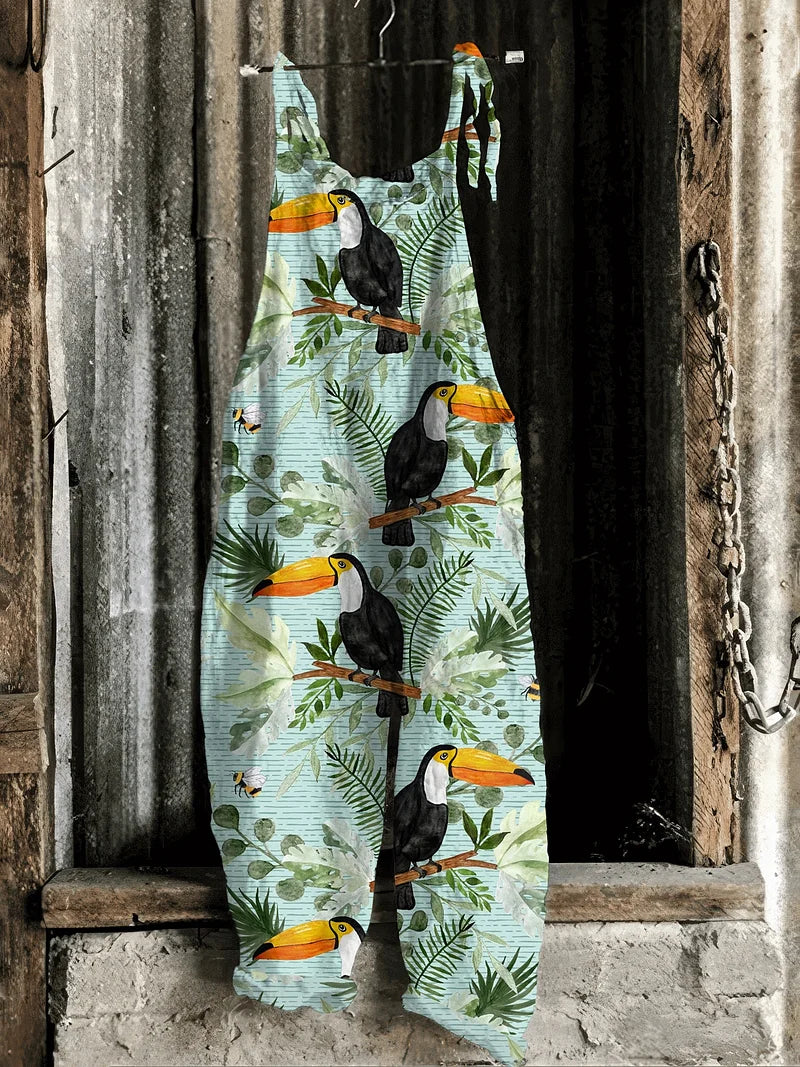 Solea | Lightweight artisanal jumpsuit in sky blue with toucan & jungle leaf print
