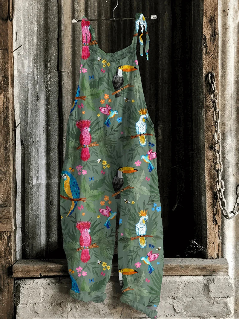 Solea | Lightweight artisanal jumpsuit in jungle green with tropical parrot & toucan print