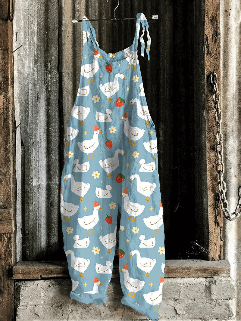 Solea | Lightweight artisanal jumpsuit in sky blue with goose & strawberry meadow print