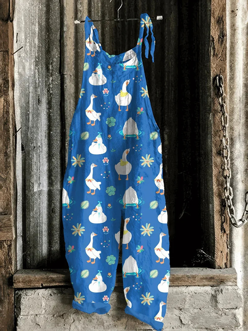 Solea | Lightweight artisanal jumpsuit in cobalt blue with playful goose & floral print