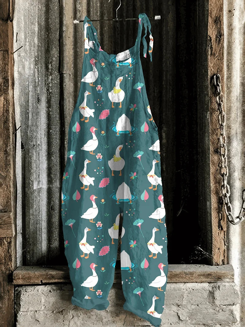Solea | Lightweight artisanal jumpsuit in teal with playful goose & floral print