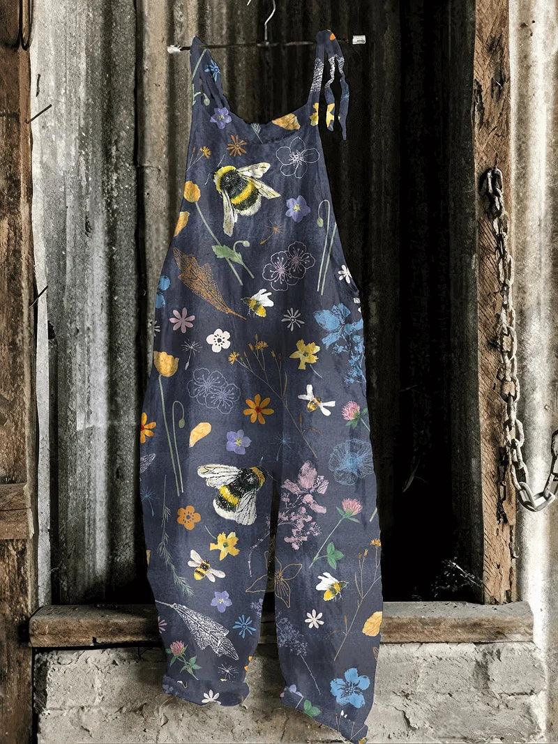Solea | Lightweight artisanal jumpsuit in navy with bees & wildflowers print